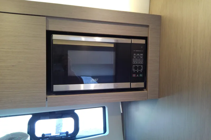 Slide: The Image of Microwave in 2024 Beneteau Gran Turismo 36 yacht kitchen, sleek modern design. - 70