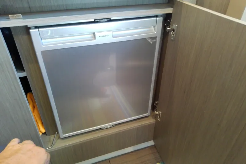 Slide: The Image of Built-in Dometic fridge in 2024 Beneteau Gran Turismo 36 yacht interior. - 71