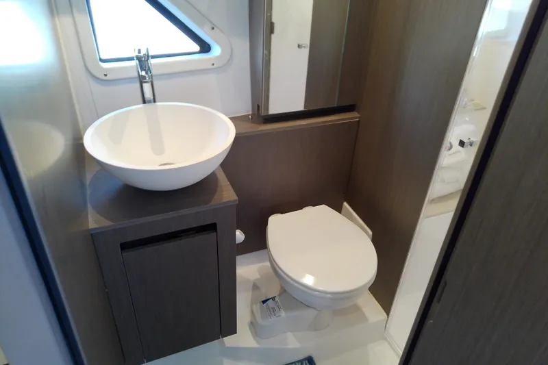 Slide: The Image of Modern bathroom in 2024 Beneteau Gran Turismo 36 yacht with sink and toilet. - 77