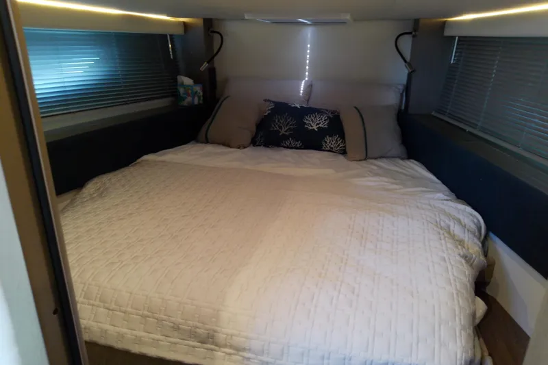 Slide: The Image of Cozy bedroom interior of 2024 Beneteau Gran Turismo 36 yacht with elegant bedding. - 80