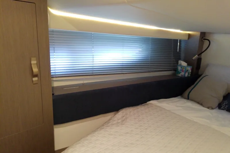 Slide: The Image of Interior cabin of 2024 Beneteau Gran Turismo 36 with bed and window blinds. - 81