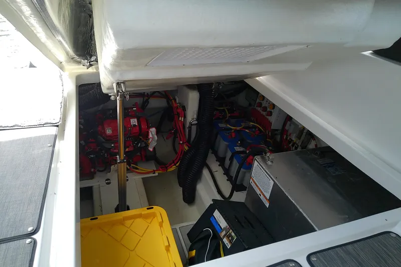 Slide: The Image of Engine compartment of 2024 Beneteau Gran Turismo 36, showcasing mechanical components and wiring. - 85