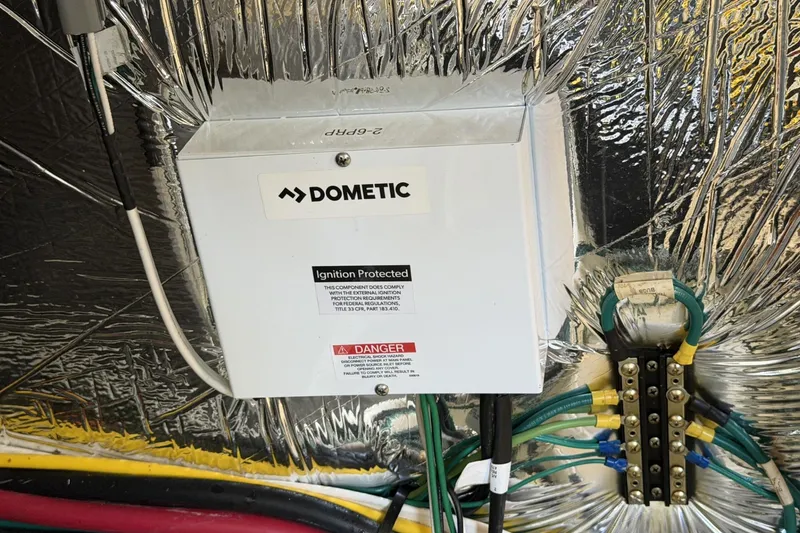 Slide: The Image of Electrical panel on a 2024 Beneteau Gran Turismo 36 yacht, featuring Dometic ignition protection. - 89