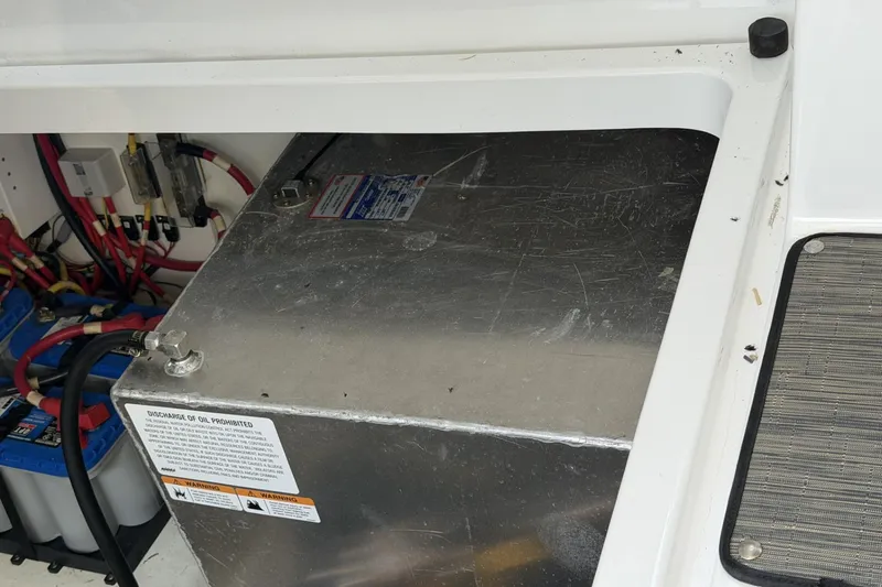 Slide: The Image of Engine compartment of 2024 Beneteau Gran Turismo 36 with battery and wiring. - 92