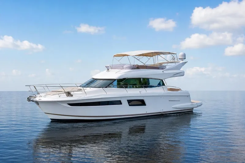 The Image of 2016 Prestige 500 yacht on calm sea under blue sky. - 0