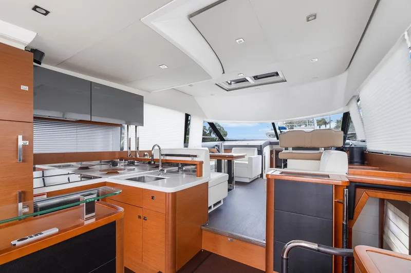 Slide: The Image of Luxurious interior of a 2016 Prestige 500 yacht with modern kitchen and seating area. - 11