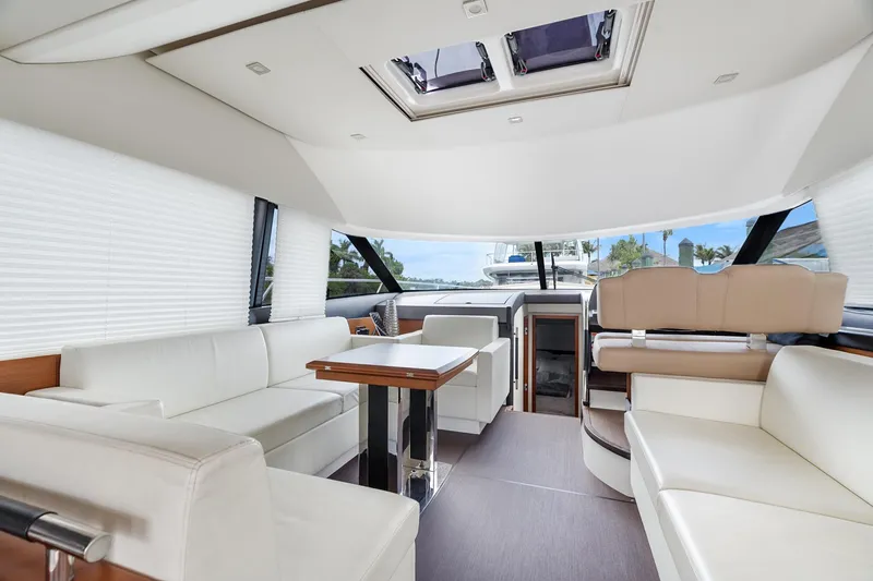 Slide: The Image of Luxurious interior of a 2016 Prestige 500 yacht with elegant seating and panoramic windows. - 14
