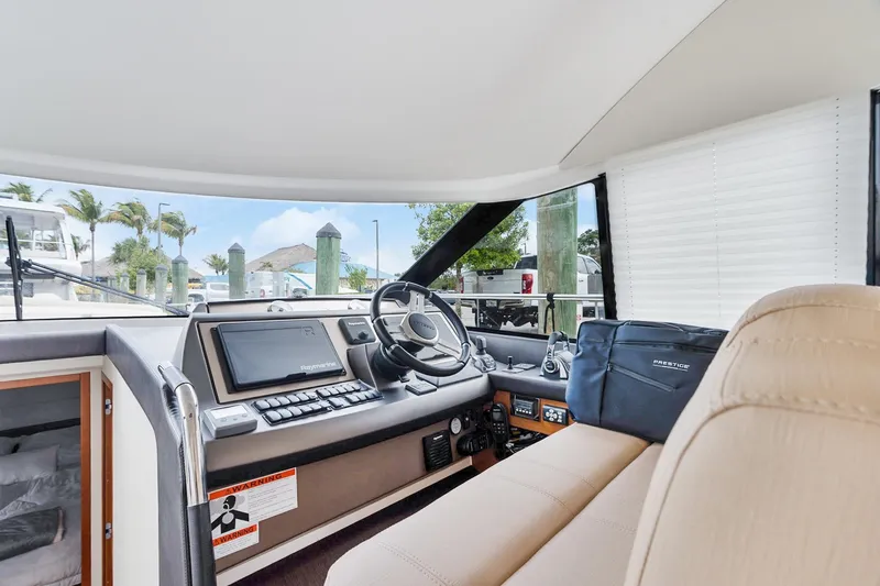 Slide: The Image of Interior view of 2016 Prestige 500 yacht cockpit with modern navigation equipment. - 15