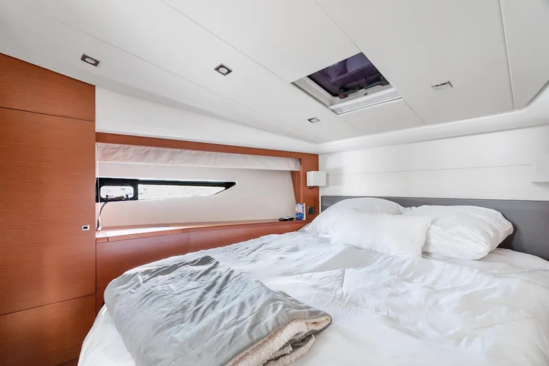 Slide: The Image of Luxurious bedroom interior of 2016 Prestige 500 yacht with modern design and cozy bedding. - 18