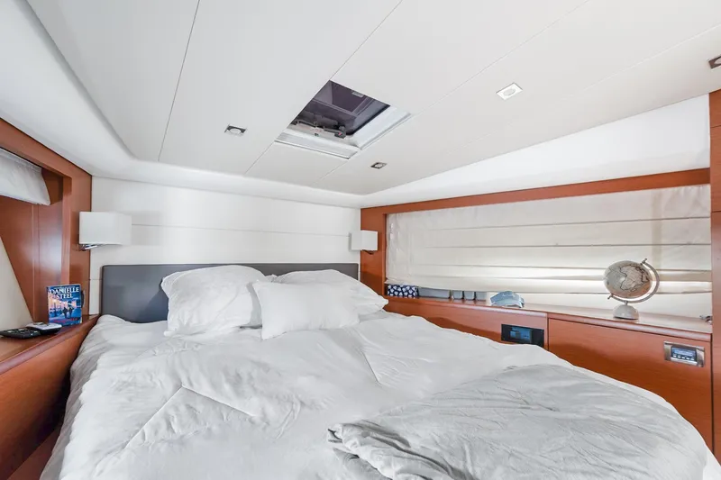 Slide: The Image of Luxurious bedroom interior of 2016 Prestige 500 yacht with cozy bedding and elegant decor. - 19