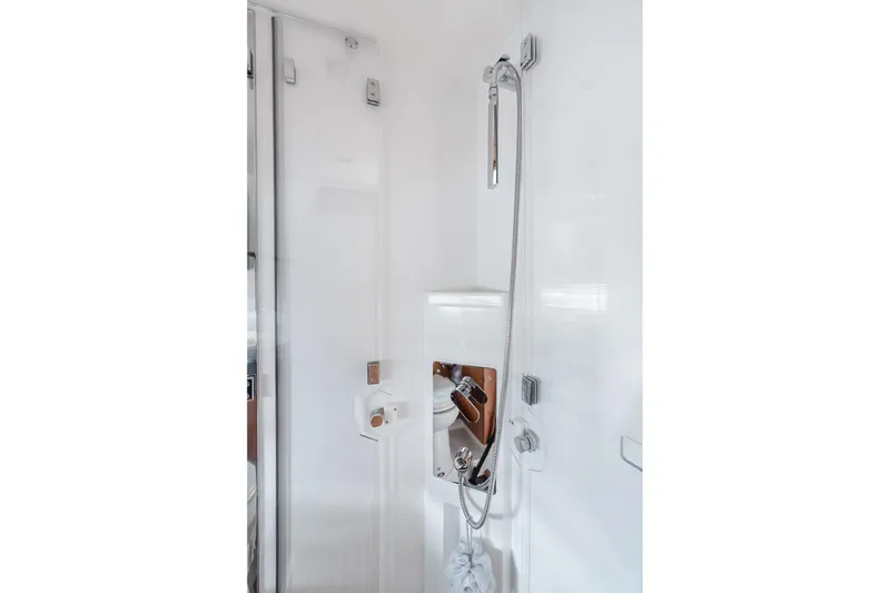 Slide: The Image of Modern shower area in 2016 Prestige 500 yacht, featuring sleek fixtures and white interior. - 21