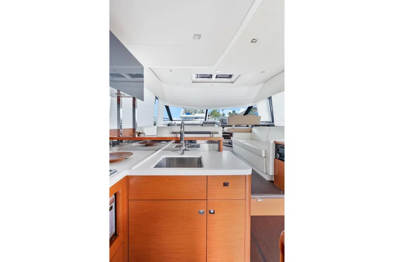 Slide: The Image of Interior of 2016 Prestige 500 yacht featuring modern kitchen and seating area. - 23