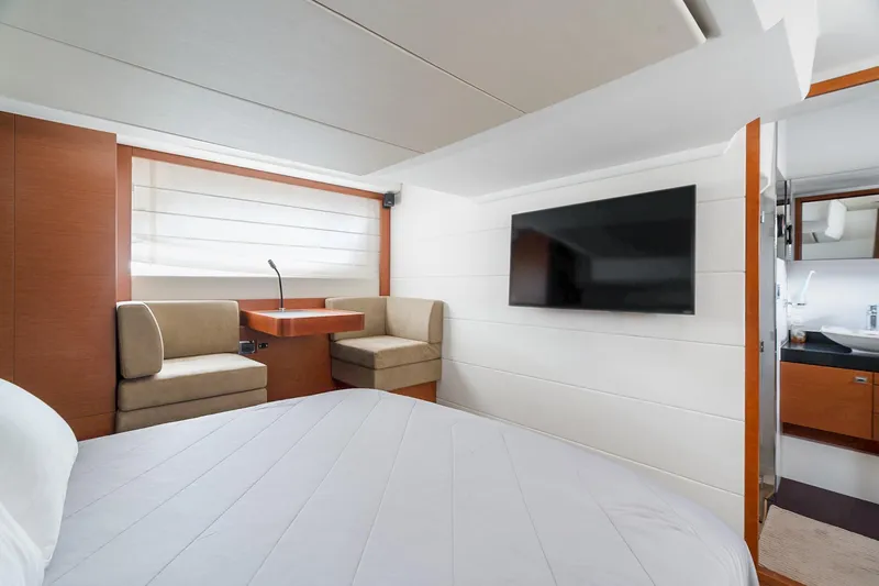 Slide: The Image of Luxurious interior of 2016 Prestige 500 yacht with modern furnishings and flat-screen TV. - 29