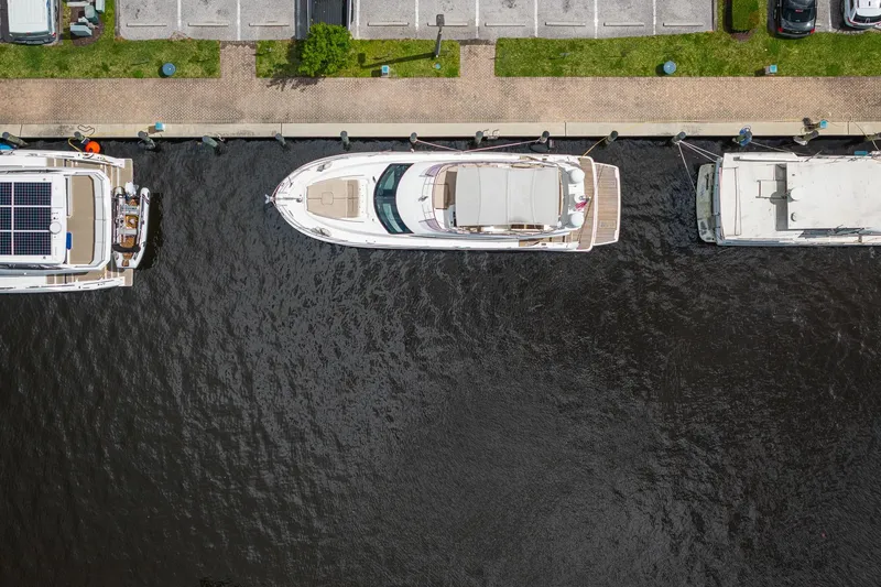 Slide: The Image of Aerial view of a 2016 Prestige 500 yacht docked at a marina. - 3