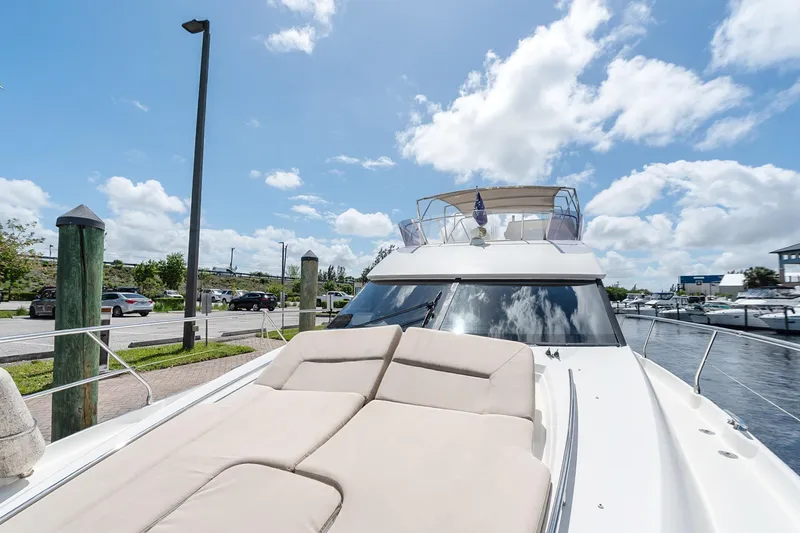 Slide: The Image of Luxurious 2016 Prestige 500 yacht docked under a bright blue sky. - 36