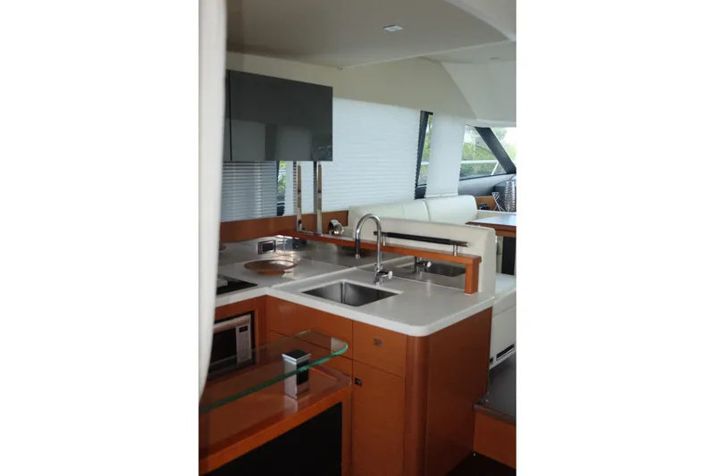 Slide: The Image of Luxurious interior of a 2016 Prestige 500 yacht featuring a modern kitchen area. - 43