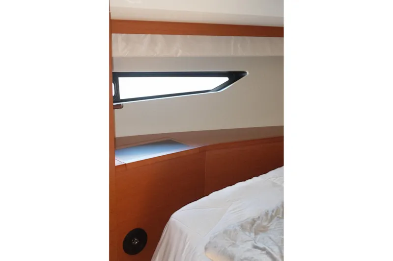 Slide: The Image of Interior cabin view of a 2016 Prestige 500 yacht, featuring a sleek window design. - 54
