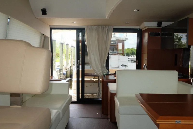 Slide: The Image of Luxurious interior of a 2016 Prestige 500 yacht with elegant seating and large windows. - 57