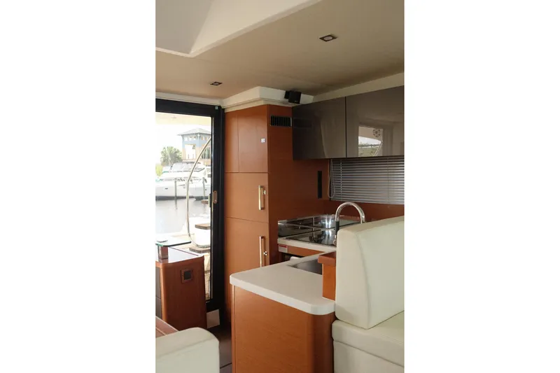 Slide: The Image of Interior of 2016 Prestige 500 yacht, featuring modern kitchen and sleek design elements. - 60