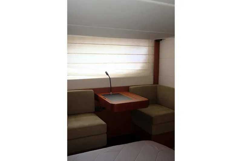 Slide: The Image of Interior of 2016 Prestige 500 yacht with cozy seating and a small table. - 62