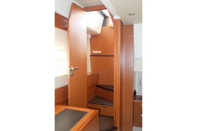 Slide: The Image of Interior view of 2016 Prestige 500 yacht, featuring wooden stairs and modern design. - 64