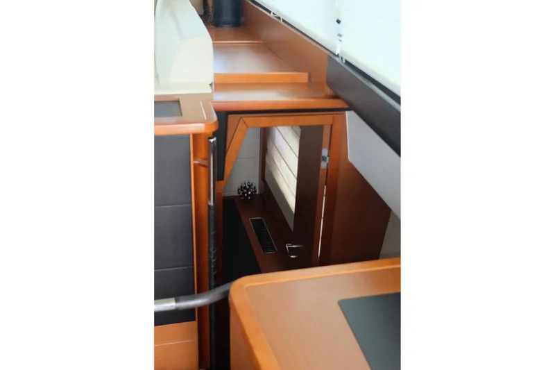 Slide: The Image of Interior view of 2016 Prestige 500 yacht, showcasing sleek wooden finishes and modern design. - 76