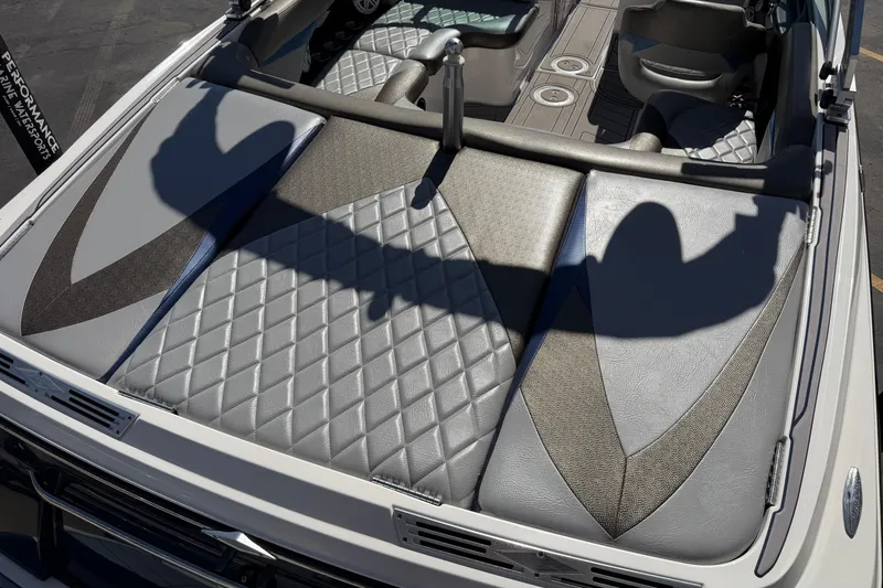 Slide: The Image of 2010 MasterCraft XStar boat interior with diamond-patterned upholstery and sleek design. - 13