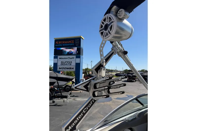 Slide: The Image of 2010 MasterCraft XStar boat tower with speakers at marine dealership. - 14