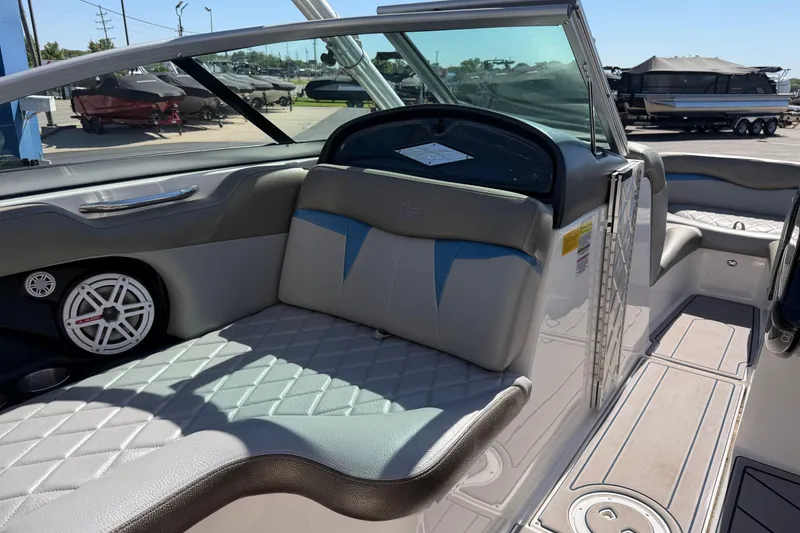 Slide: The Image of 2010 MasterCraft XStar boat interior with quilted seating and speaker system. - 15
