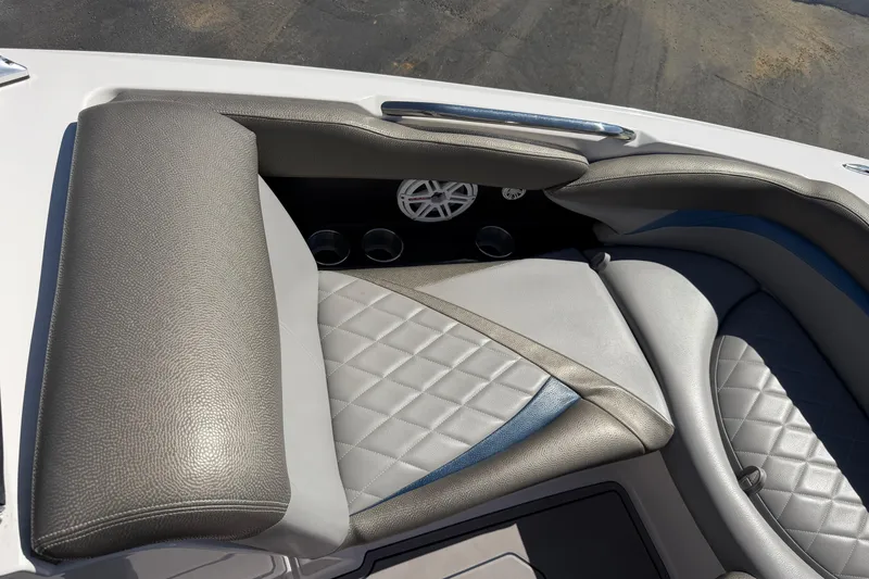 Slide: The Image of 2010 MasterCraft XStar boat interior with gray and blue quilted seating. - 20