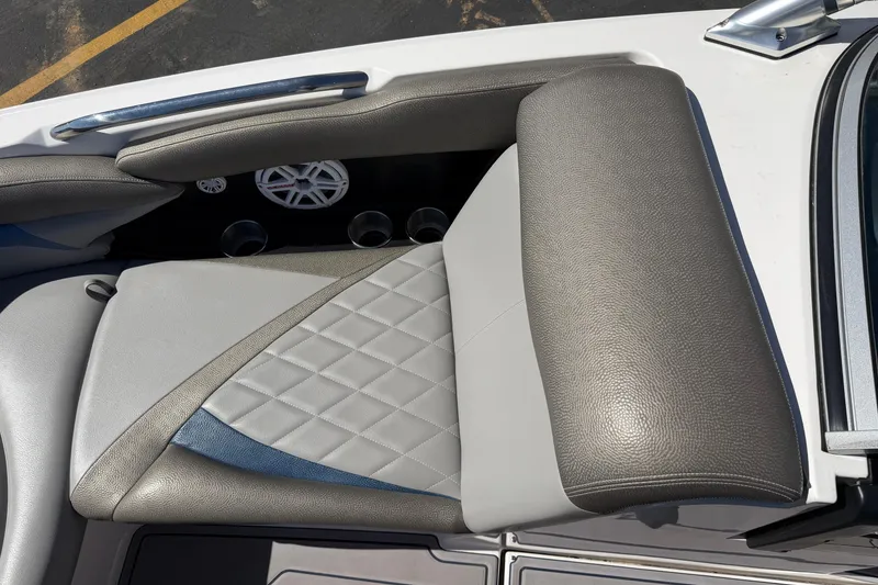 Slide: The Image of 2010 MasterCraft XStar boat seat with quilted upholstery and cup holders. - 21