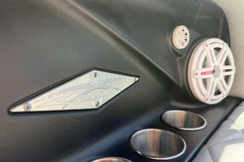 Slide: The Image of Interior of 2010 MasterCraft XStar boat with speakers and cup holders. - 23