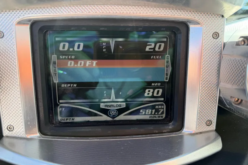 Slide: The Image of Dashboard of a 2010 MasterCraft XStar boat showing speed, fuel, and depth readings. - 25