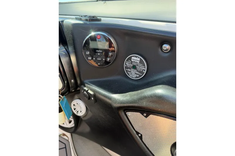 Slide: The Image of Dashboard of a 2010 MasterCraft XStar boat featuring Clarion audio controls. - 26