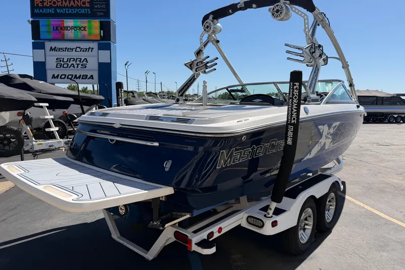 Slide: The Image of 2010 MasterCraft XStar boat on trailer at Performance Marine Watersports dealership. - 6