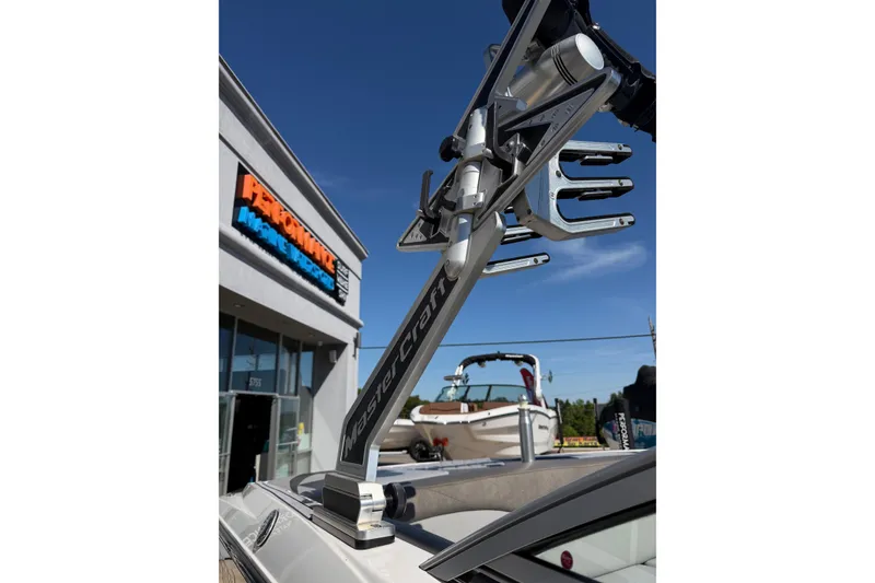 Slide: The Image of 2010 MasterCraft XStar boat with wakeboard tower at Performance Marine dealership. - 9