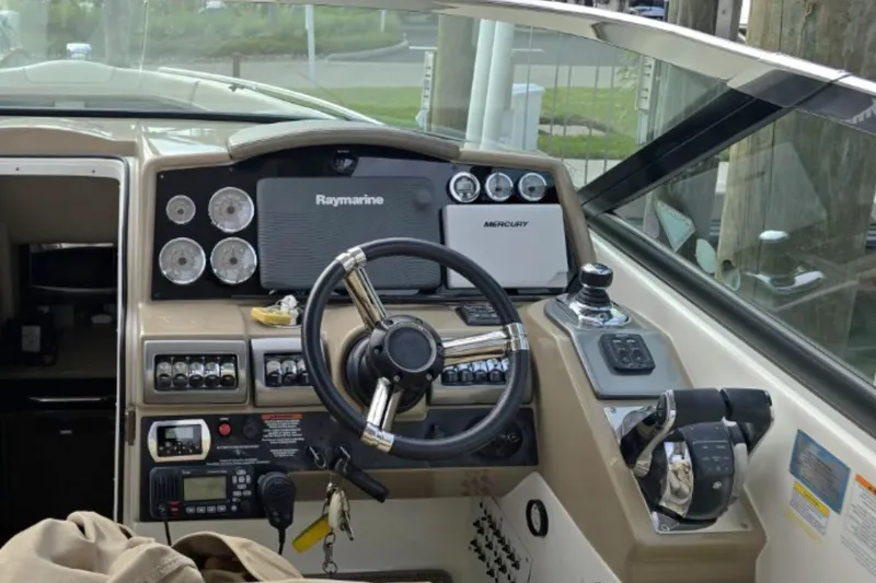 Slide: The Image of 2015 Formula 350 Crossover Bowrider I/O dashboard with steering wheel and navigation controls. - 12