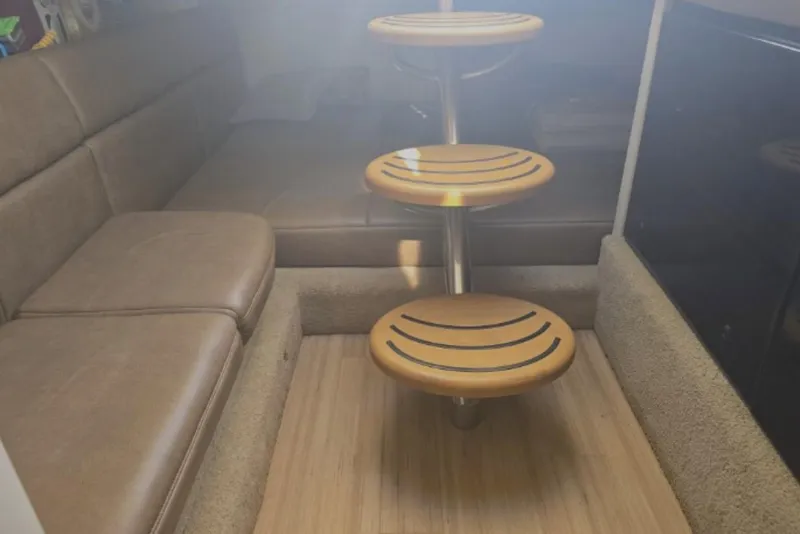 Slide: The Image of Interior of 2015 Formula 350 Crossover Bowrider I/O with wooden steps and seating area. - 18