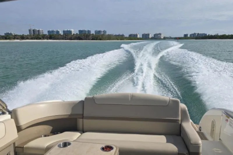 Slide: The Image of 2015 Formula 350 Crossover Bowrider I/O cruising on open water, leaving a wake trail. - 13