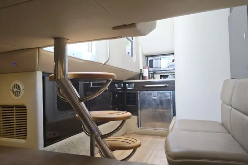 Slide: The Image of Interior of 2015 Formula 350 Crossover Bowrider I/O with modern seating and spiral staircase. - 17