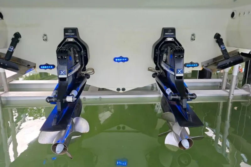 Slide: The Image of 2015 Formula 350 Crossover Bowrider I/O with dual Mercury outdrives in water. - 21