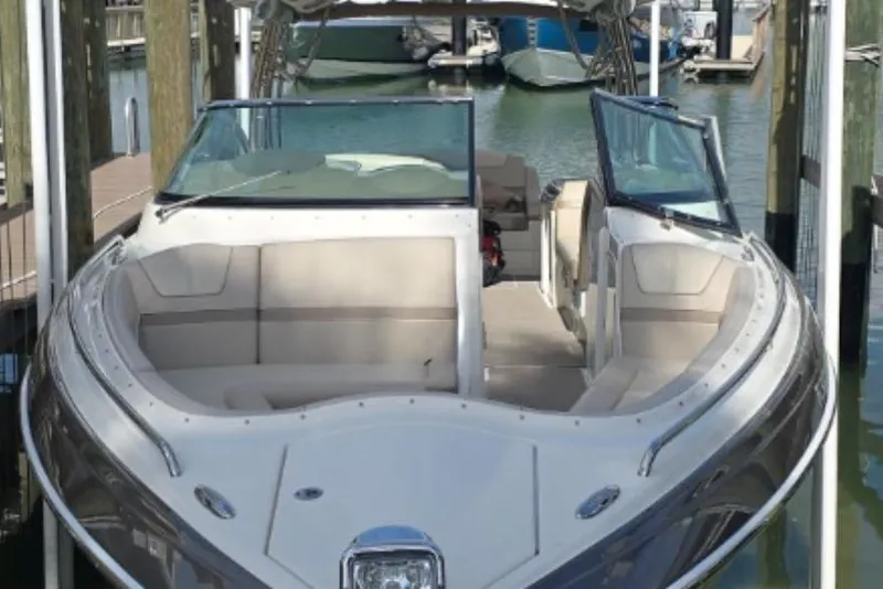Slide: The Image of 2015 Formula 350 Crossover Bowrider I/O docked in a marina, showcasing spacious seating. - 4