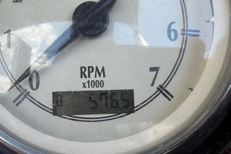 Slide: The Image of Close-up of a 2007 Bennington 2574 GL tachometer showing 5765 RPM. - 10