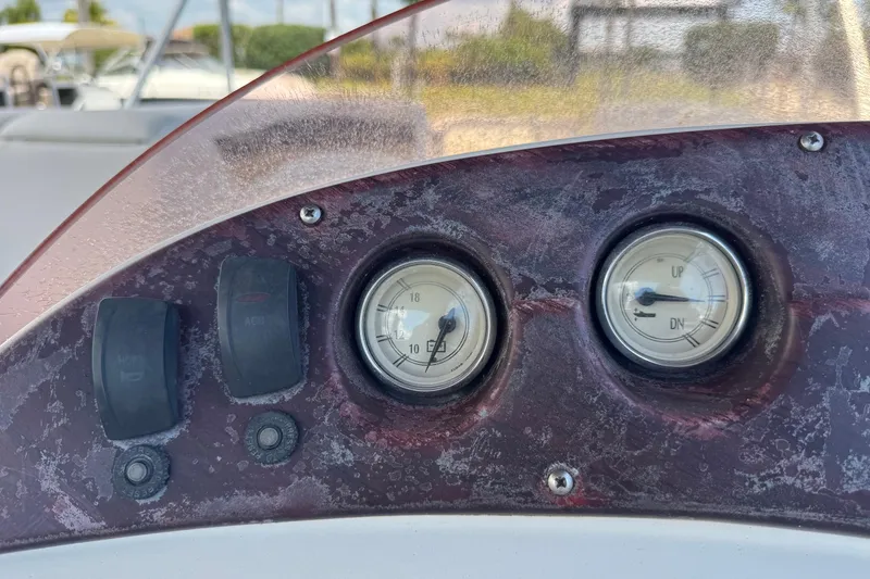 Slide: The Image of Dashboard of a 2007 Bennington 2574 GL boat with gauges and switches. - 11