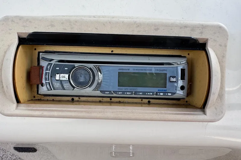 Slide: The Image of Marine stereo system on a 2007 Bennington 2574 GL boat dashboard. - 14