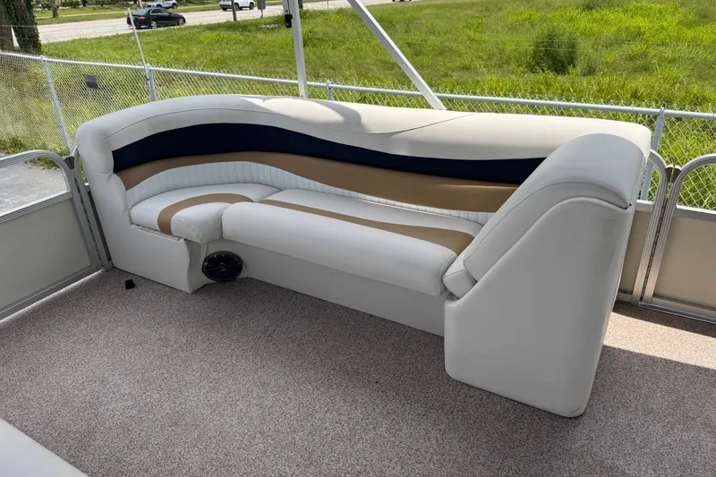 Slide: The Image of 2007 Bennington 2574 GL pontoon boat interior with stylish seating and carpeted flooring. - 18