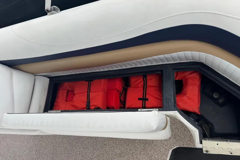 Slide: The Image of Storage compartment with life jackets on a 2007 Bennington 2574 GL boat. - 22