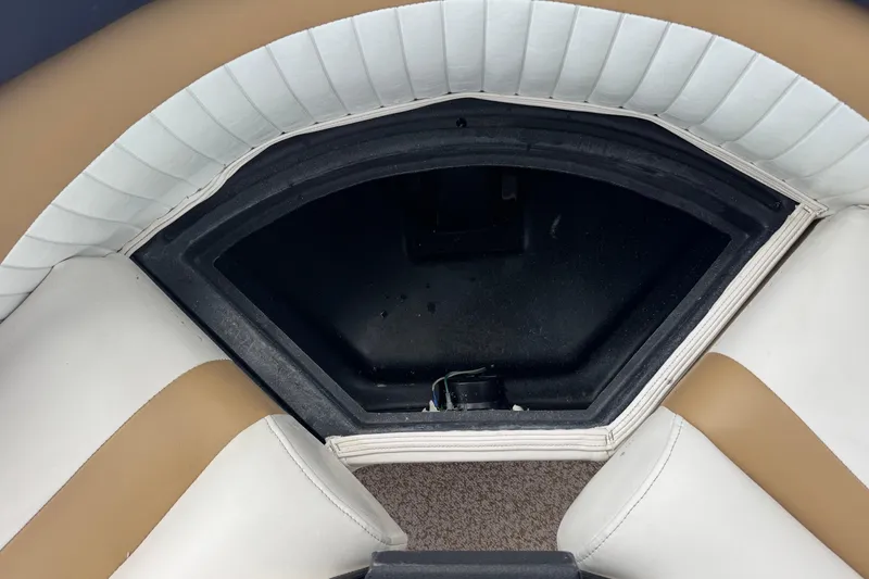 Slide: The Image of Storage compartment in a 2007 Bennington 2574 GL boat with cushioned seating. - 27