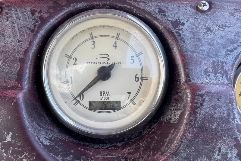 Slide: The Image of Close-up of a Bennington 2574 GL 2007 RPM gauge, showing 0 RPM. - 9