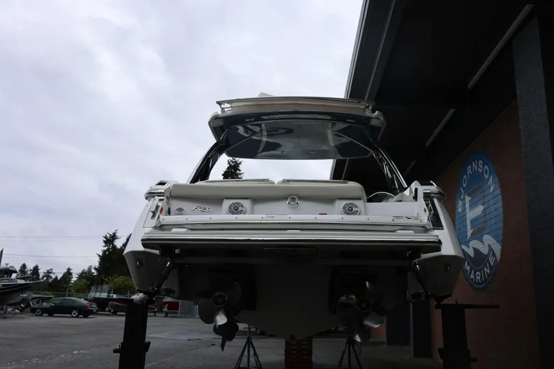 Slide: The Image of 2021 Cobalt R30 boat on stands at a marina, rear view. - 10